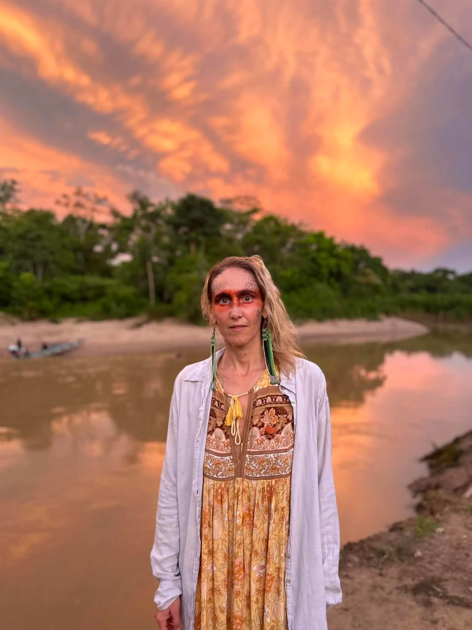 Samantha Claire by an Amazon river at sunset